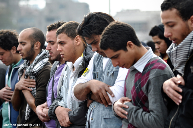 Egyptian protesters praying, photo taken by Jonathan Rashad.