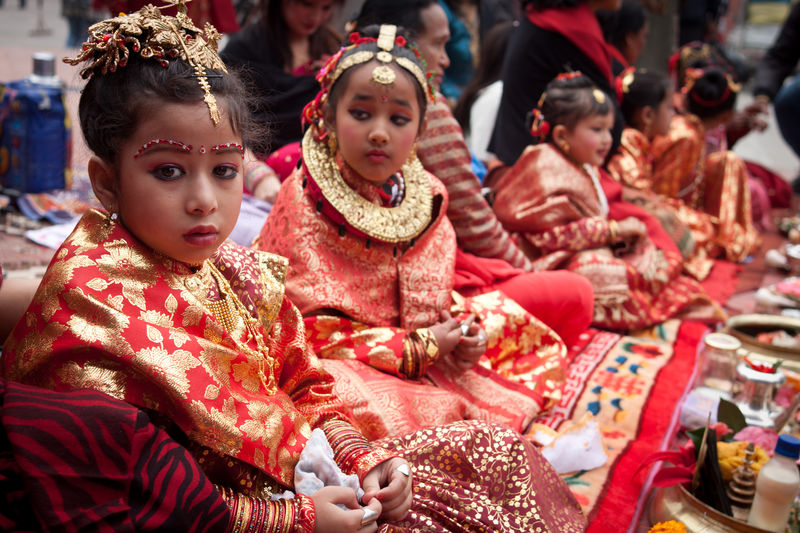 Girls from Newar community wearing traditional wedding dresses take part in Bael Bibaha, a practice where a girl is wed to a bael fruit, representing one of the gods, before her marriage. Image by  Nabin Baral. Copyright Demotix (3/12/2011)