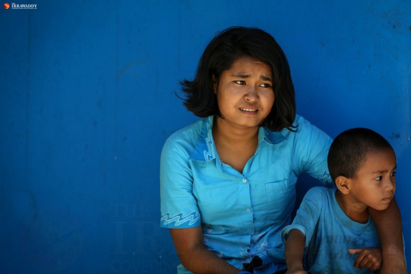Ma Thiri Suu Kyi, 16, is seen together with her little brother Mg Zin Ko Win. She decided not to continue going to school in Yangon because she’s embarrassed to be in the 7th grade with students much younger than her. Photo and caption by Hein Htet/The Irrawaddy.