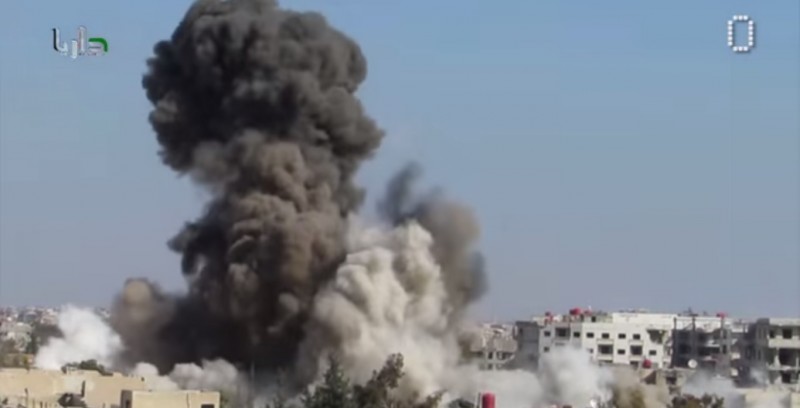 A screenshot of a YouTube video by  SyrianZero reportedly showing barrel bombs dropped by the Assad regime.