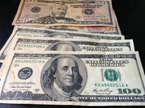 Counterfeit $100s and $50s from "Willy Clock," allegedly the online alias of a Texas man living in Uganda.